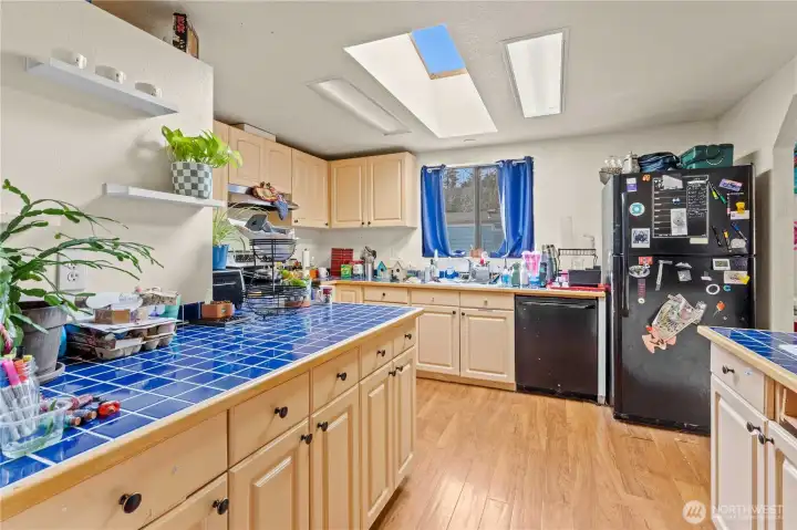 Kitchen w/Tiled Counters and Skylight for plenty of Natural Light!