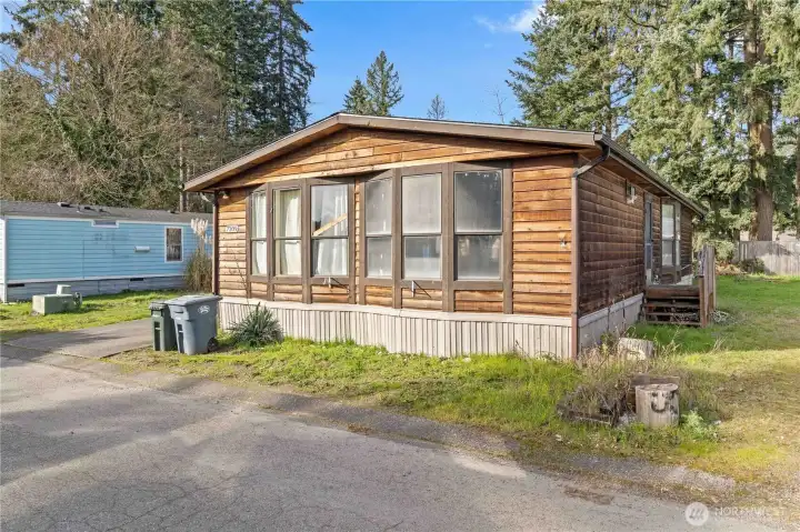Front Facing/Laundry Door. Home has Vinyl Skirting which is in good shape.