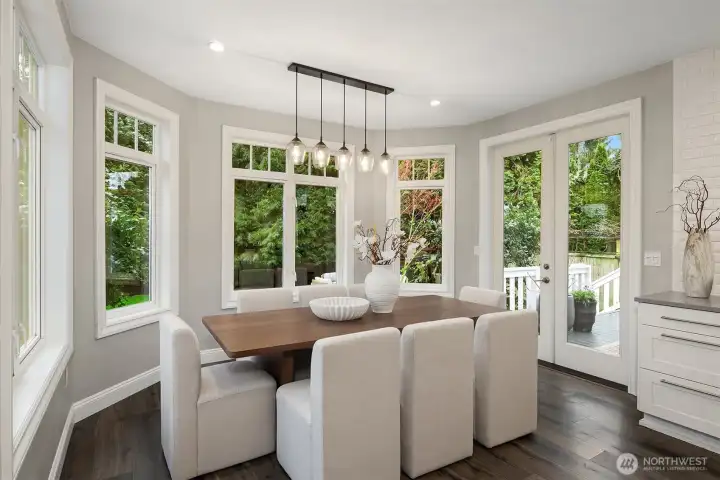 Dining area surrounded by greenery + natural light