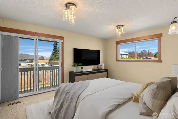 Primary bedroom with private deck.  Virtually Staged