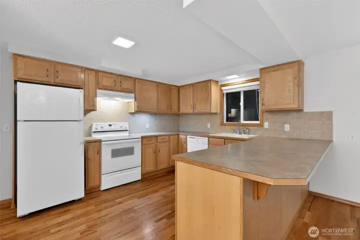 updated kitchen with maple cabinets