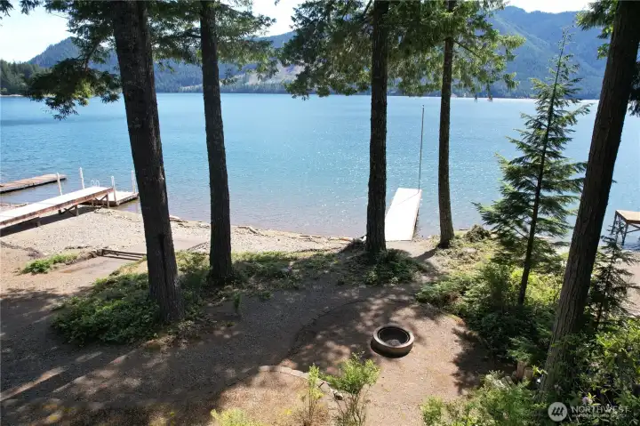 Firepit, cabins, lake, dock, deck..all the boxes are checked!
