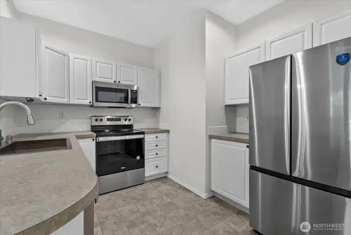 Kitchen with updated appliances and sink Kitchen with updated appliances and sink