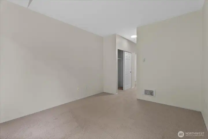 Primary bedroom with spacious walk-in closet and secondary closet Primary bedroom with spacious walk-in closet and secondary closet