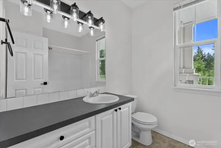 Full second bathroom with bathtub and shower Full second bathroom with bathtub and shower