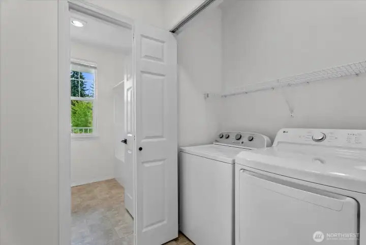 Hallway with full size laundry and storage Hallway with full size laundry and storage