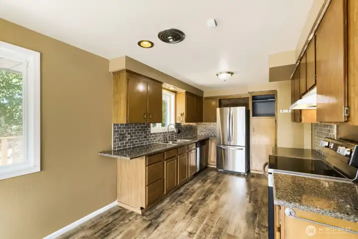 Kitchen located on the upper level Kitchen located on the upper level
