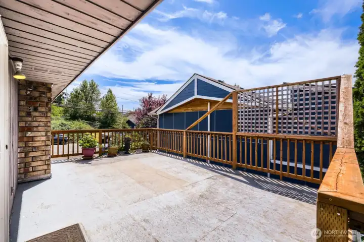 upper level deck over garage. Wraps around to upper level backyard deck. upper level deck over garage. Wraps around to upper level backyard deck.