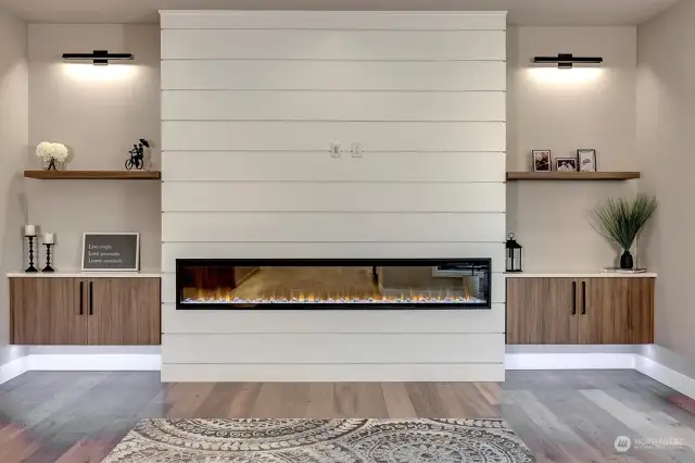100" Linear Fireplace with built-in cabinetry featuring under cabinet lighting.