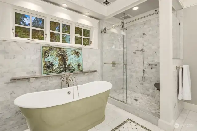 Soaking tub and generously sized shower.