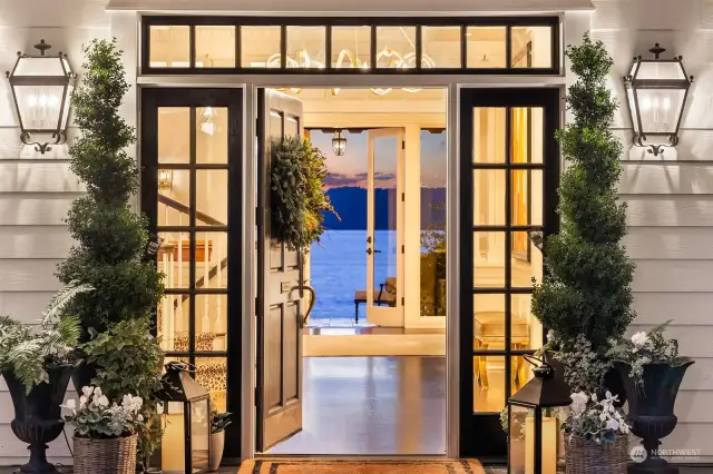 Step onto the charming front porch reminiscent of iconic coastal living. Open the main door to the dark blue waters of Puget Sound omnipresent throughout the property.