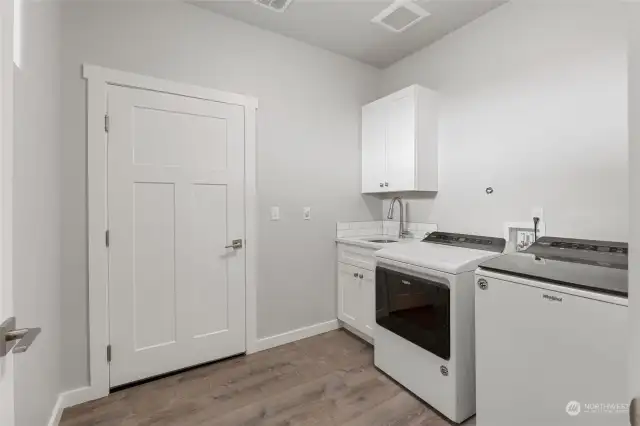 Laundry Room with entrance to garage