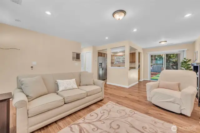family room with newer laminate flooring