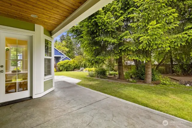 Covered patio off of the kitchen so you can enjoy the yard all year.