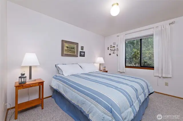 Main floor primary bedroom with attached bath.