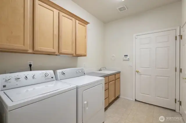 Laundry with sink and storage