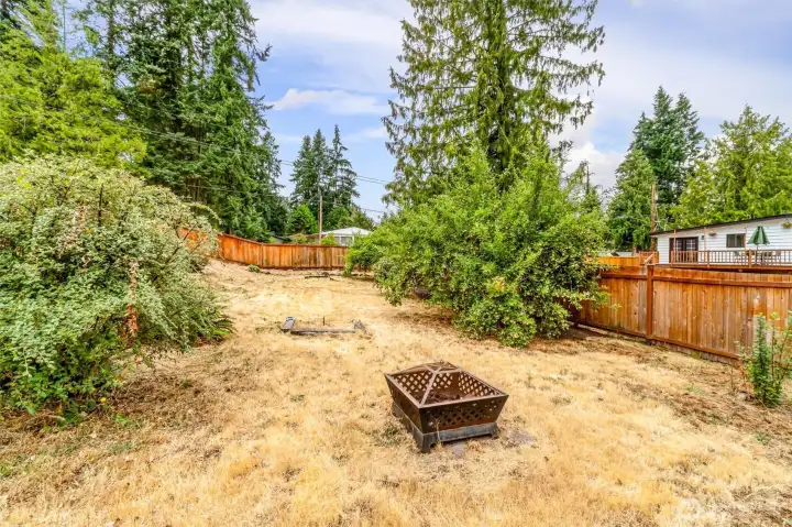 A view of the ovweside yard and fruit trees