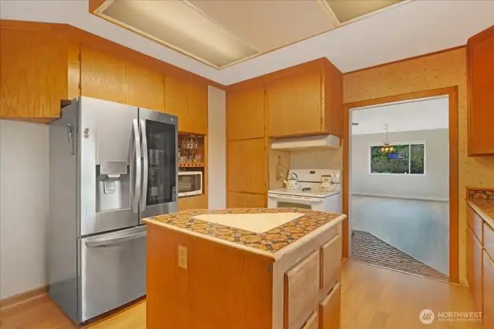 Kitchen is located in the middle of the home