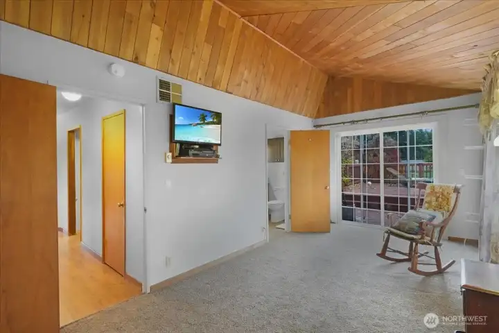 Primary bedroom with Primary bedroom with a slider door to the outside private area