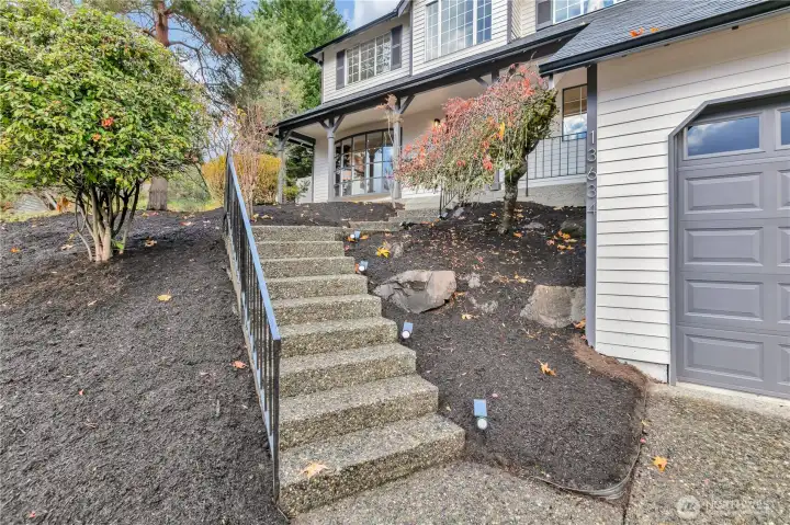 Pathway and front steps leading to covered entry