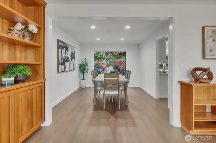 Dining room off kitchen with views of the landscaped backyard.