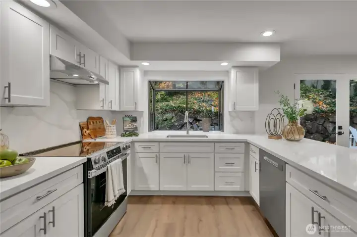 Large garden window overlooks the backyard.