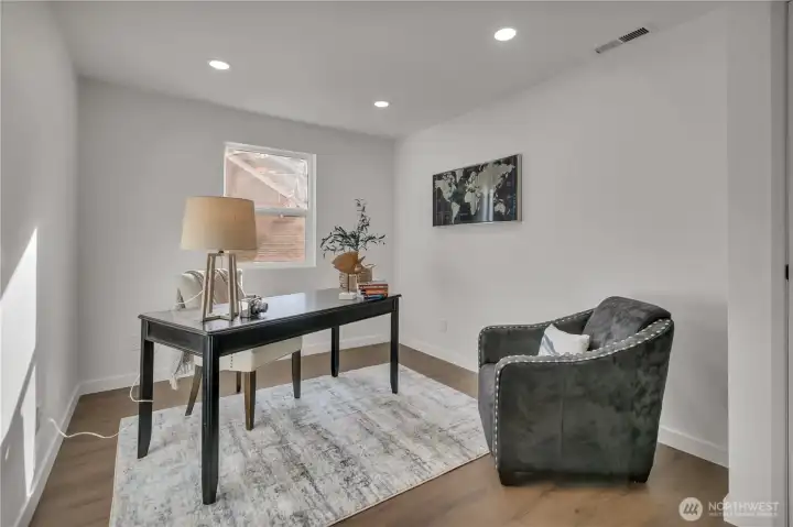 Bedroom off family room, currently staged as an office.
