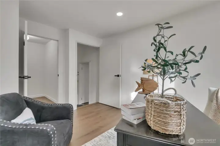 Two closets, one walk-in and another with shelving.