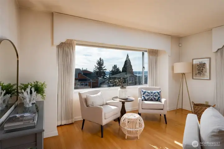 Living room has original oak floor hardwoods and high-up-on-street views.