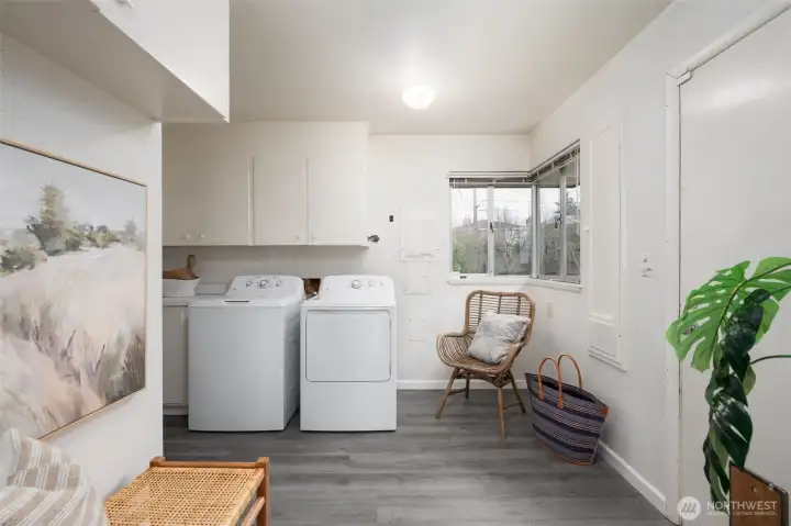 Off the kitchen is a utility room with exterior entrance to yard and laundry.