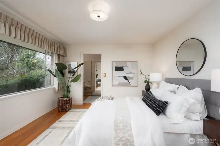 Primary bedroom and oak floors.