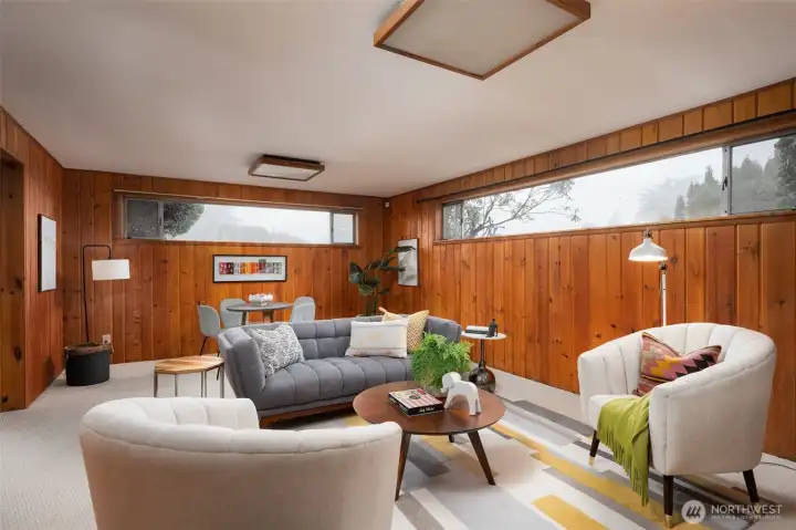 Lower level faces south & west so a lot of daylight.  New carpets, original paneling.