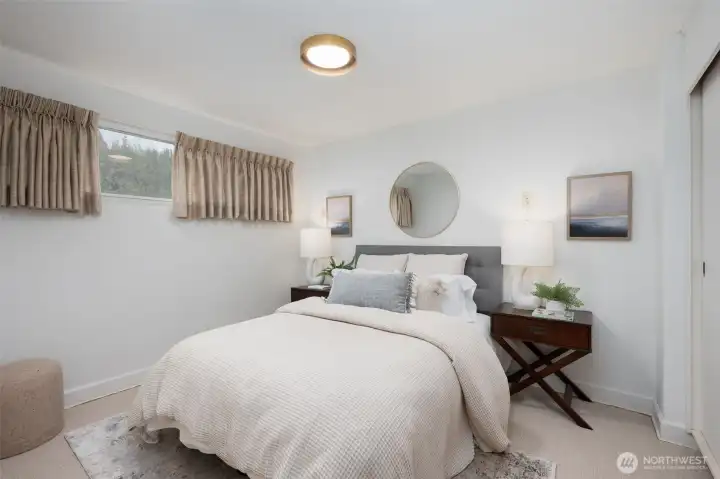 Lower level bedroom with new berber style carpet.