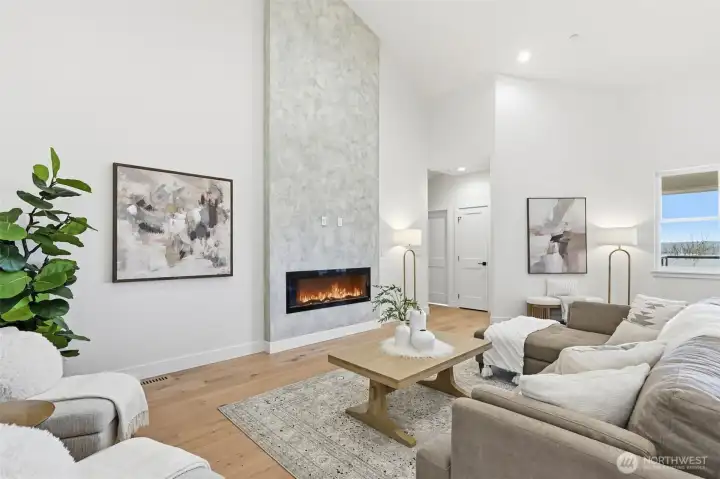 Bright open-concept living with vaulted ceilings.