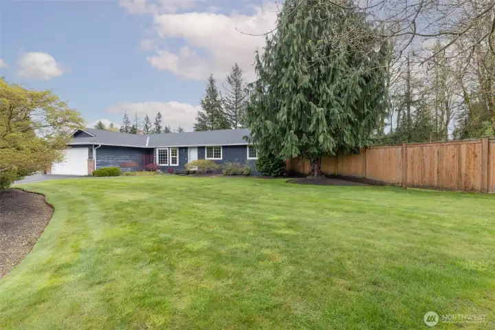 Spacious front yard offering plenty of room for outdoor enjoyment, gardening.