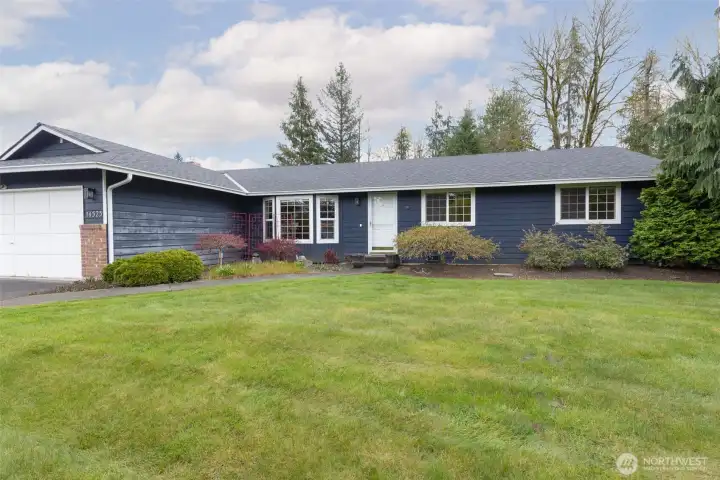 Front exterior of the home facing west, offering warm afternoon and evening light.