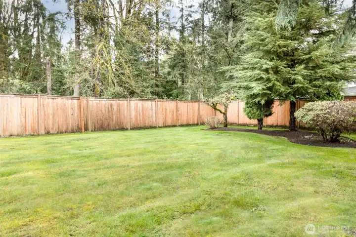 Backyard offering plenty of room for entertaining, outdoor gatherings, and recreation.