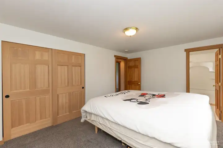 Primary bedroom with full bath, closet with organizers. Large window provides natural.