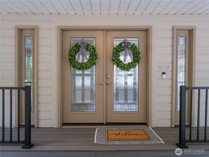 A quiet moment of arrival, where the feeling of home begins before you even step inside. Framed by soft neutral tones and clean lines, the covered entry with new Trex deck draws you in with an effortless sense of calm.