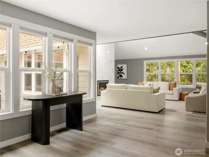 Natural light fills the space from every angle, creating a bright, easy atmosphere that carries throughout the home.