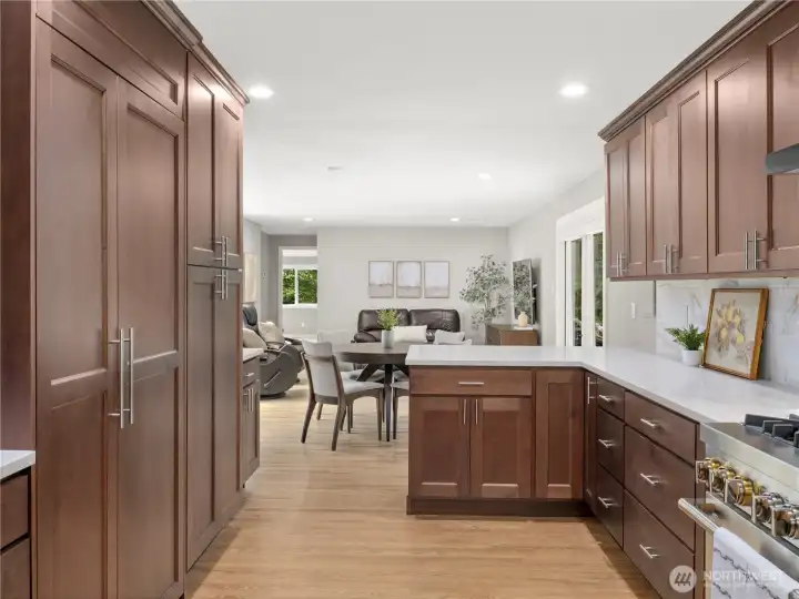 Notice the custom refrigerator, with built-in matching cabinetry? No expense was spared designing this space for the current owner!