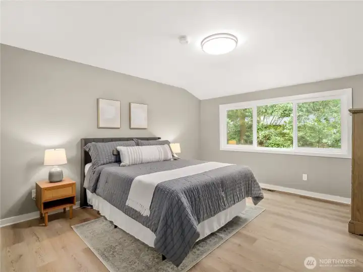 Both of the additional bedrooms are generous in size, light and bright with new....everything!