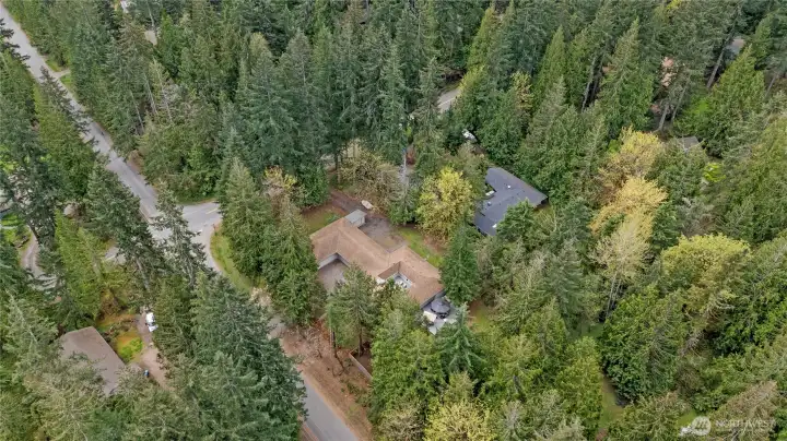 Ideally positioned on a large, wooded lot with convenient access and a private feel.