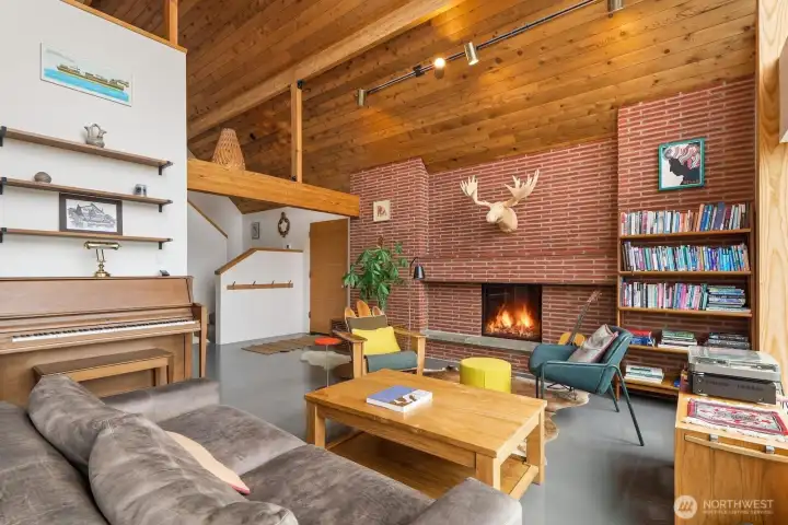 Tongue-and-groove wood vaulted ceilings give the space a mid-century modern vibe.