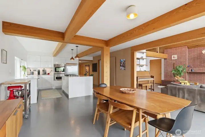Polished concrete floors and wood beam ceilings frame this space for unforgettable dinner parties.