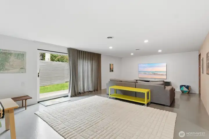This sprawling family room is located just off of the kitchen - ready for movie nights, Mariners games, and creating lasting memories at home.