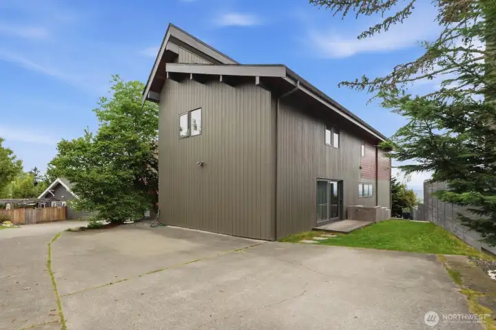 Dedicated off-street parking is hidden behind the home off of a private driveway shared by only a few homes.