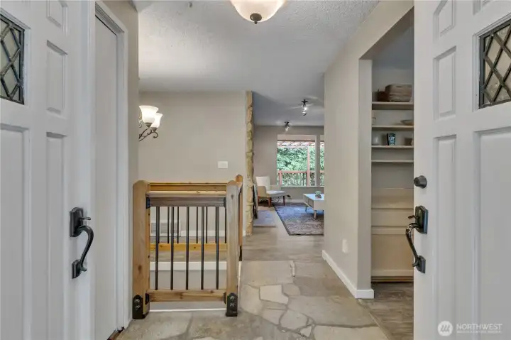 Enter through the welcoming double doors to your own private lodge in the woods. Stone entryway and vinyl plank flooring throughout. Enter through the welcoming double doors to your own private lodge in the woods. Stone entryway and vinyl plank flooring throughout.