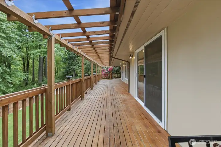 Another view of the deck facing toward the living room. The slider in the foreground leads to the primary bedroom. The home is freshly painted inside and out. Another view of the deck facing toward the living room. The slider in the foreground leads to the primary bedroom. The home is freshly painted inside and out.