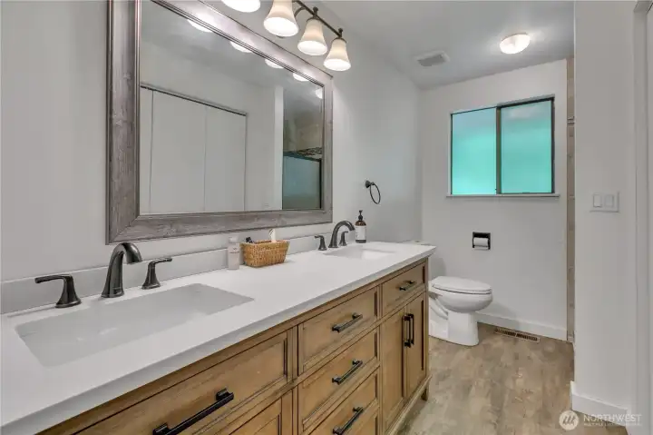 Double sinks and new cabinets in the primary bathroom. Spa shower for your enjoyment. There is also a huge clothes closet. Double sinks and new cabinets in the primary bathroom. Spa shower for your enjoyment. There is also a huge clothes closet.